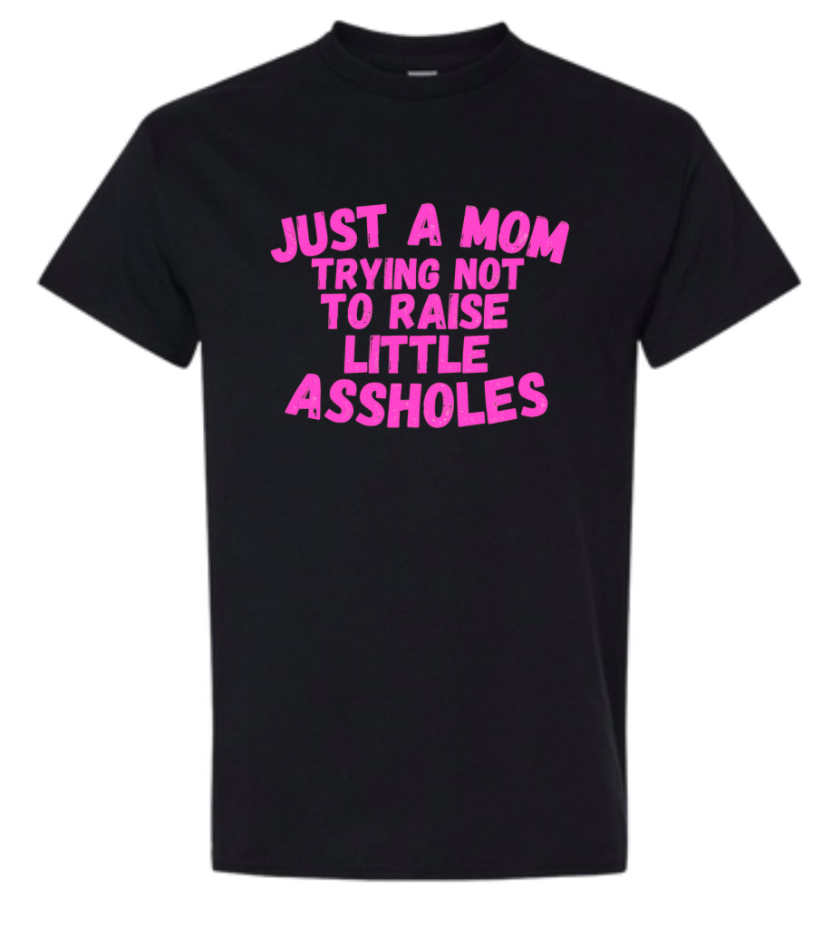 Just a Mom trying not to raise little Assholes Heavy Cotton T-shirt