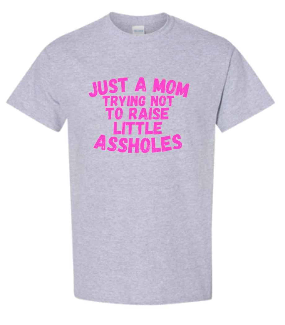 Just a Mom trying not to raise little Assholes Heavy Cotton T-shirt