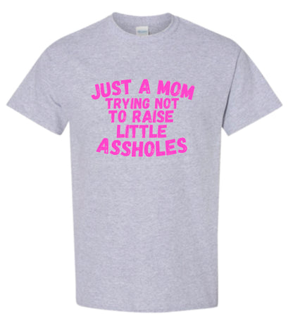 Just a Mom trying not to raise little Assholes Heavy Cotton T-shirt
